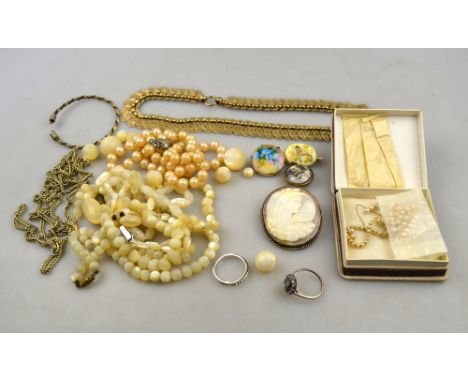 A collection of vintage jewellery including shell cameo of veiled female, spectacle style locket containing photo of Queen Al