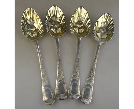 Four embossed and chased silver berry spoons, of Georgian origin