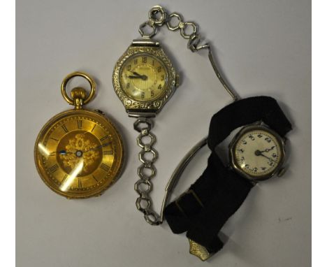 A lady's open faced 18k fob watch with engraved decoration and gilt dial, to/w a silver Buren wristwatch with 15 jewel moveme