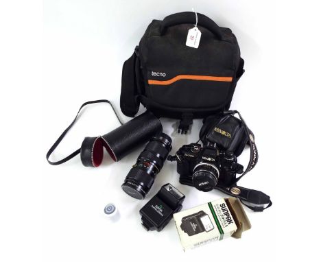 Minolta X-700 camera, with associated lens and flash, within fitted carry case