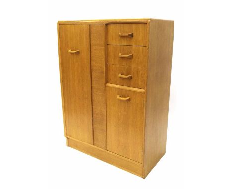 E Gomme for G Plan - light oak tallboy, with full length hanging cupboard to the left alongside three short drawers over a sh