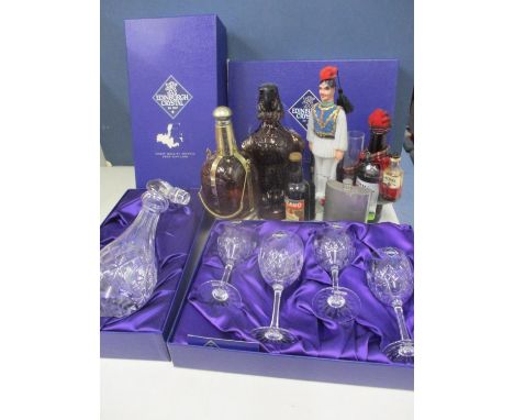 An unused Edinburgh crystal decanter and four wine glasses in two presentation boxes, together with mixed vintage novelty dec