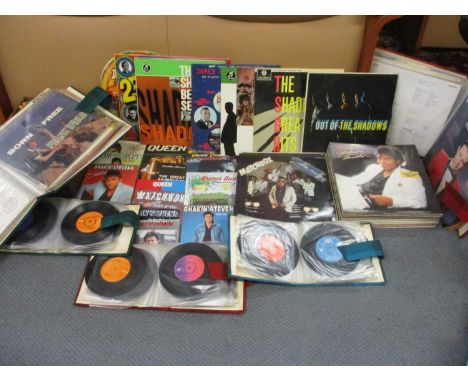 A collection of 1950s - 1980s records to include Shakin' Stevens, Queen and Freddie Mercury 45rpms and Michael Jackson and th