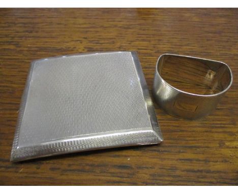 Silver to include a cigarette case and a napkin ring, both with engine turned decoration 