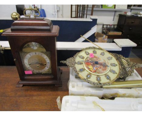 A Stewart mahogany cased bracket style mantel clock with Westminster chimes striking on a gong, along with a gilt metal wall 