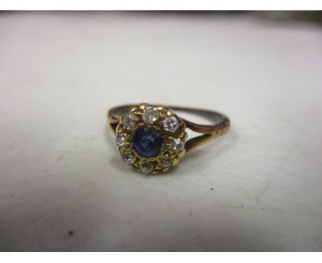 A sapphire and diamond 18ct gold cluster ring 