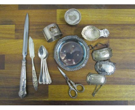 A mixed selection of silver to include a tea caddy spoon, decanter labels, napkin ring, scissors, a small box, Birmingham 197