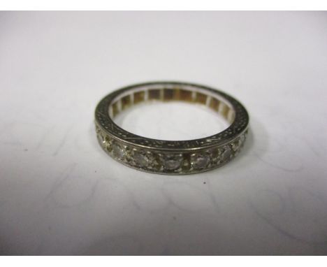 A white metal diamond paste stone eternity ring 