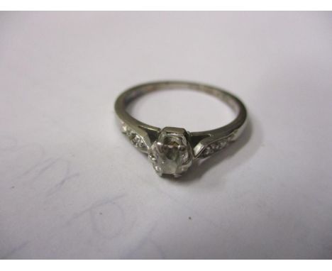 A diamond white metal engagement ring 