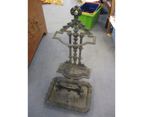 A Victorian cast iron stick/umbrella stand together with a boot scraper 