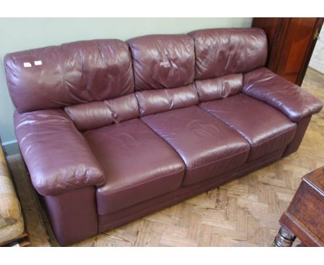 A good quality leather two seater sofa and a large armchair 