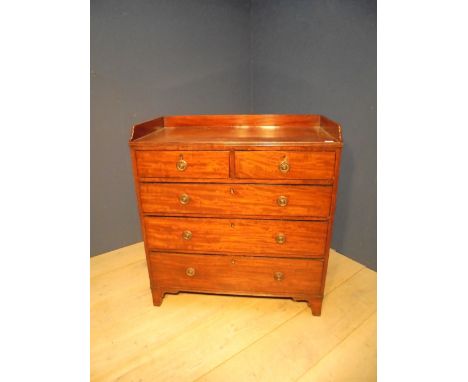 Victorian mahogany chest of drawers, with three-quarter galleried top about two short drawers and three long drawers on brack