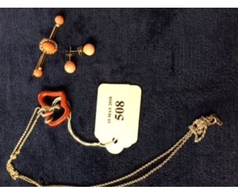 Tiffany Apple pendant, boxed; a coral &amp; seed pearl bar brooch on yellow metal mount (not hallmarked) and a pair of coral 