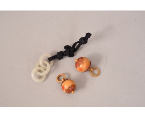 Pair of Chinese hornbill pendants and a jade triple-hoop