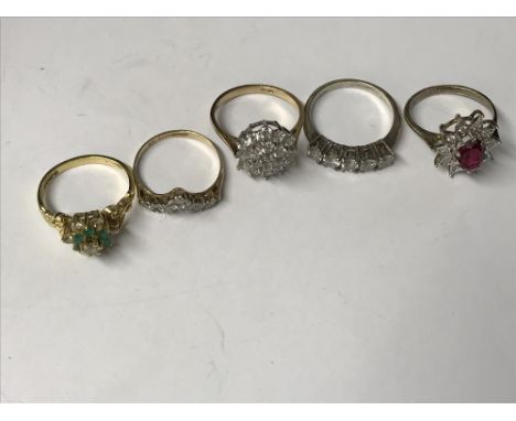 Two cubic zirconia rings, and a garnet and diamond red ring on silver gilt shank, an 18carat gold diamond cluster ring and an