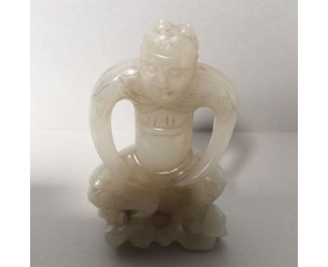 Chinese jade carving of a horned man in seated pose 7cmH