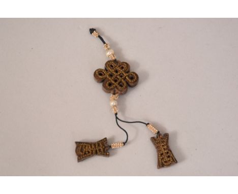 C18th Chinese aloeswood and pearl pendant.