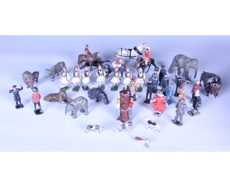 A collection of mostly Britains lead figures, including an Ayrshire cow and calf, other farm animals, a boxing clown, a clown