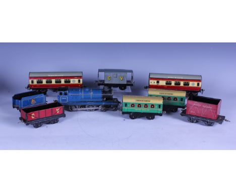 A collection of Chad Valley gauge O railway items, including a clockwork locomotive 10138 and tender in BR blue, two 'The Fly