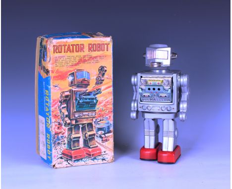 An SH Japan tinplate and battery-powered Rotator Robot, boxed (some playwear, on/off switch missing, box lid creased, torn an