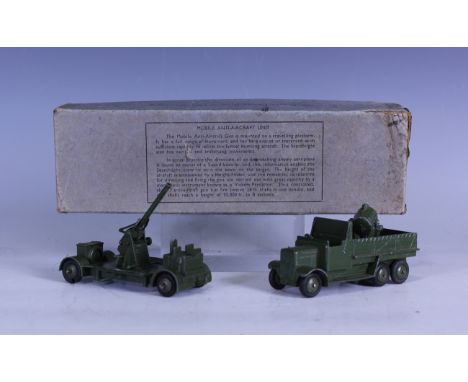 A Dinky Toys No. 161 mobile anti-aircraft unit, boxed (paint chips, box creased, torn, scuffed and stained).Buyer’s Premium 2