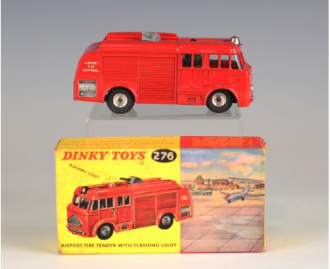 Four Dinky Toys vehicles, comprising a No. 277 Superior Criterion ambulance, a No. 276 airport tender with flashing light, a 