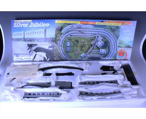 A Hornby Railways gauge OO limited edition R.837 Silver Jubilee train set, with certificate, together with an R.1032 Mainline