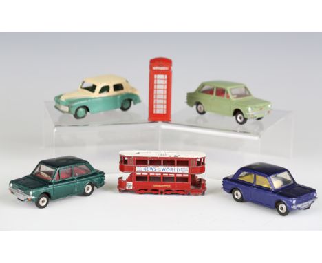 A small collection of diecast vehicles, comprising a Dinky Toys No. 154 Hillman Minx, two No. 138 Hillman Imps, a No. 40H tax