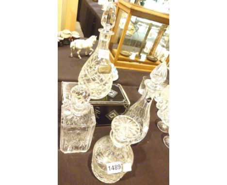 Four Edinburgh crystal decanters and silver wine label