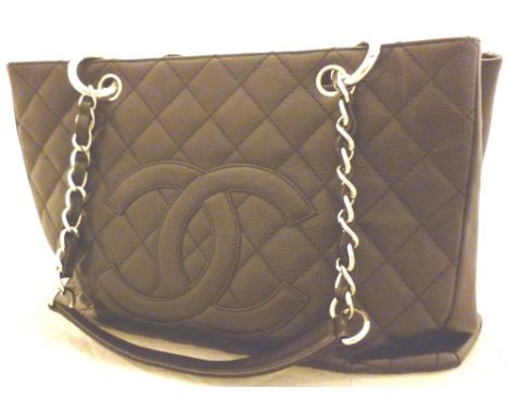 Genuine Coco Chanel black handbag  CONDITION REPORT: This item has a outside pocket on the back, Also, this item has no tasse