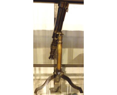 Brass telescope on tripod stand