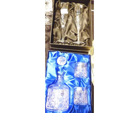 Boxed whisky decanter and glasses by Royal Scotland crystal and two boxed champagne flutes by Gleneagles crystal  