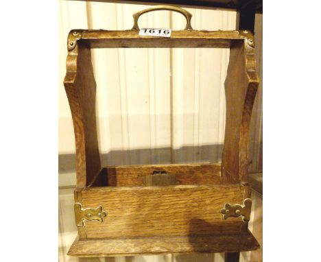 Antique wooden tantalus with brass mounting lacking decanters 