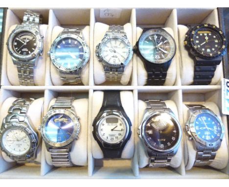 Display case containing ten gents wristwatches including Casio, Lorus, Sekonda etc
