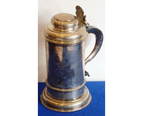 A rare mid-17th century hallmarked silver lidded Tankard of round straight sided section and having a cast scallop shell and 