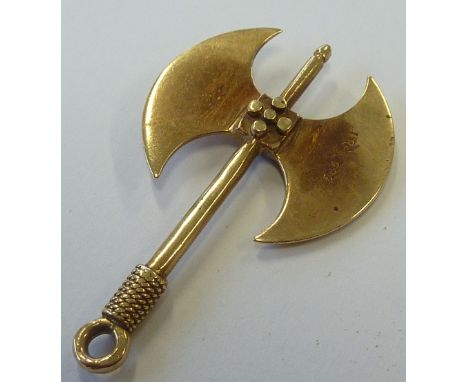 A gold Pendant modelled as a double-bladed Viking style axe, one blade marked 585 18C; 4.25cm, approx. 5.8g