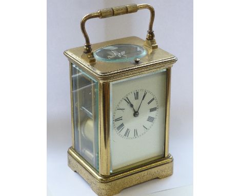An early 20th century gilt metal and glass-sided Repeater Carriage Clock, the white enamel dial with Roman numerals and the g
