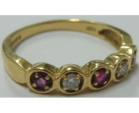 A ladies 18-carat yellow gold Dress Ring set with two diamonds and three rubies; ring size 'M' 