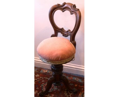 A William IV/early Victorian rosewood adjustable Music Chair on tripod base terminating in French scrolls, 87cm (highest poin