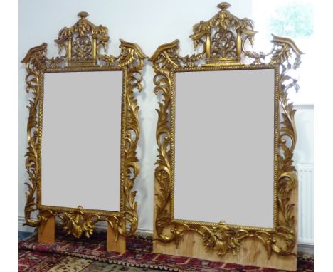 A fine and large pair of wall hanging carved giltwood Looking Glasses in the mid 18th Century Chippendale rococo style, each 