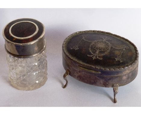 An early 20th century silver and tortoiseshell lidded oval Jewellery Box with neo-classical piqué-work style decoration above