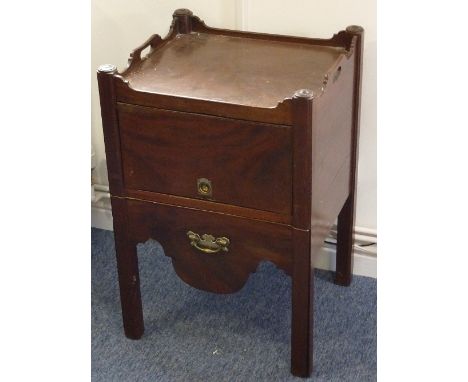 An 18th Century mahogany Commode, the two handled galleried top above a lift out fall with recessed brass ring handle, furthe