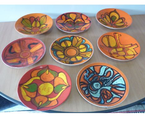 ADDED LOT     Eight Poole Studio Pottery Dishes, each with abstract design against an orange ground CONDITION REPORT: Some mi