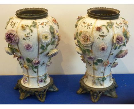 A pair of late-19th/early-20th century Continental porcelain and metal mounted baluster-shaped Vases, each delicately decorat