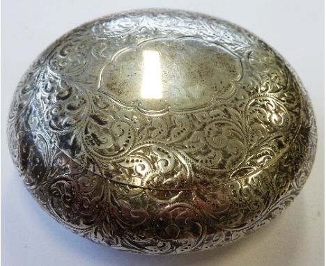 A hallmarked silver oval table Snuff Box, central oval vacant cartouche surrounded by a profusion of foliate-style engraving,