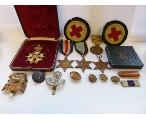 A cased Legion d'honneur together with the Burma Star, the Atlantic Star, the France and Germany Star, a British Red Cross So