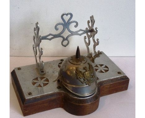 An early 20th century metal Ink Stand modelled as a First World War style Pickelhaube, 17.5cm wide 