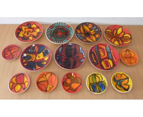 ADDED LOT    An assortment of 14 (in two different sizes) Poole Studioware Dishes   CONDITION REPORT:  Some glaze crazing on 