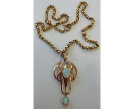 A 9-carat yellow gold, Arts and Crafts style Pendant with a central opal cabouchon and smaller opal dropper below, upon a gol