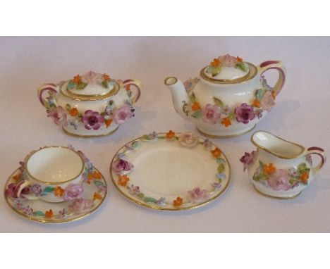 A Coalport miniature Tea Set comprising Teapot, Cream Jug, covered Sucrier, Cup, Saucer and Side Plate, each encrusted with f